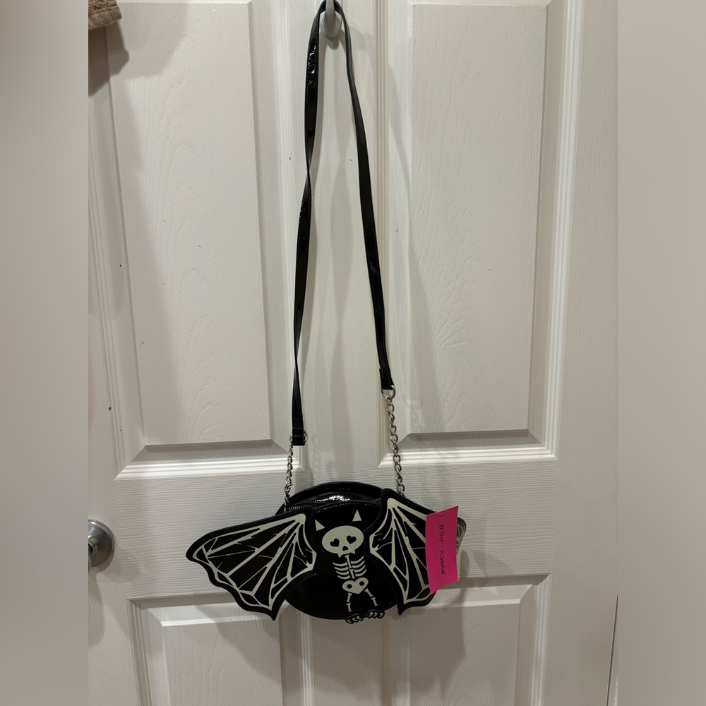Betsey Johnson Wings are adjustable and bat glows in the dark.